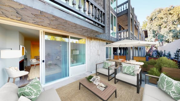 a patio with furniture and a table at The Meadows Apartments, Culver City , CA 90230