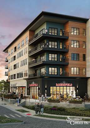 A street view of a building with the sign at The District at Deerfield Residences Apartments, Mason, OH, 45040