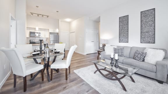 a living room with a couch and a dining table