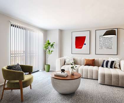 a living room with a white couch and a coffee table