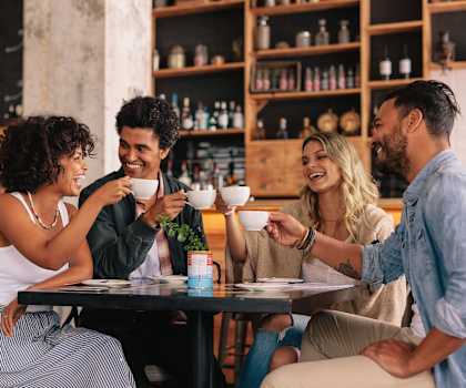 a group of people sitting at a table drinking coffee at Courthouse Green Apartments, Chesterfield