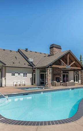 A spacious gym with a variety of equipment including treadmills, weights, and exercise machines at Stoneplace Apartment Homes, Molalla, OR, 97038