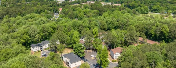 a aerial view of a neighborhood with houses and trees at Hidden Woods, Decatur, 30035