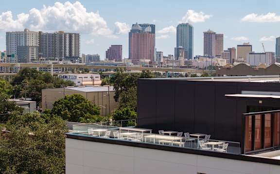 A cityscape with a modern building in the foreground.