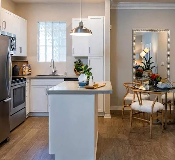 Island Kitchen with Breakfast Bar and Adjacent Dining Space