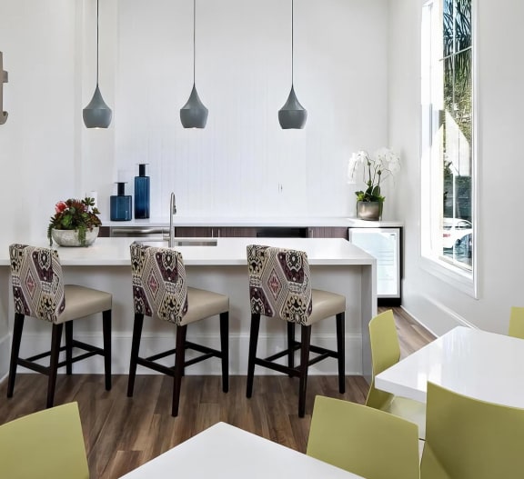 a dining room with a table and chairs at Amerige Pointe, Fullerton