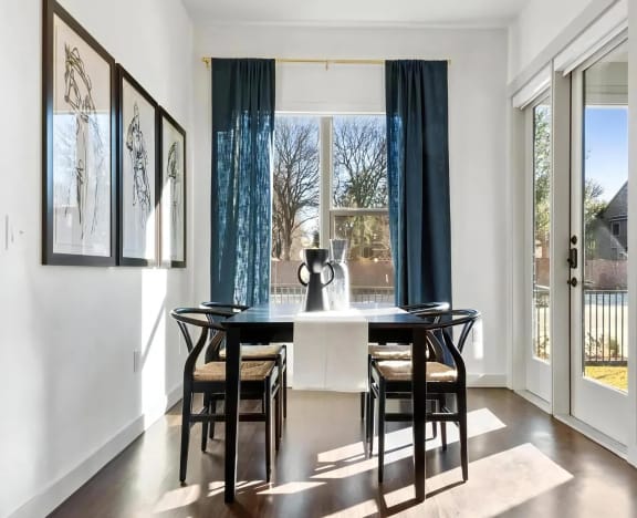 The Elm at River Park Apartment Featuring Sunlit Dining Area with Large Windows