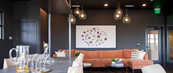 Modern bar-style seating area with comfy sofa and delicate lighting at Novel Cary
