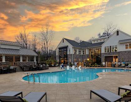 Pool with Clubhouse with Sunset Background
