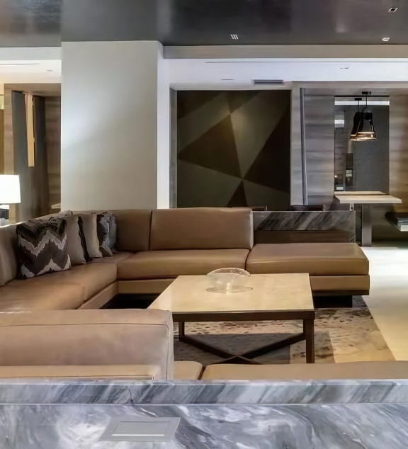 a living room with a fireplace and a couch and a table