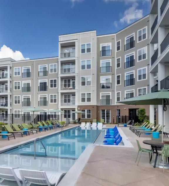 Broadstone Upper Westside Community Pool Resort Style Pool with In Pool Chaise Lounges