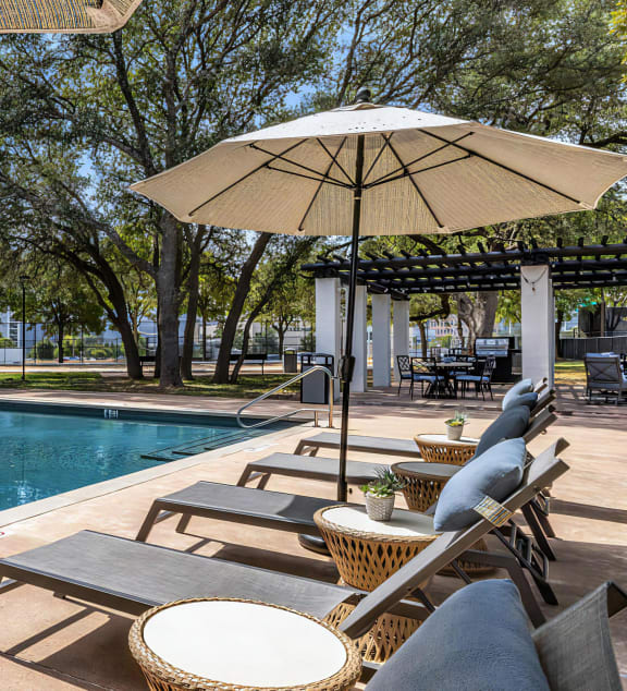 Mesa Verde Pool Second Pool with Sunbathing Loungers Shade Umbrellas and Adjacent Outdoor Covered Lounge