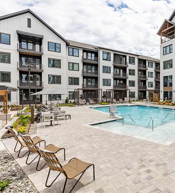 our apartments have a large pool and lounge chairs