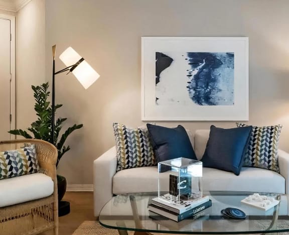 a living room with a couch and a glass coffee table at Amerige Pointe, California, 92833