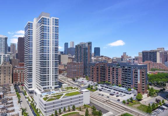 an aerial view of the city with skyscrapers at The Elle Apartments in West Loop, Chicago, IL