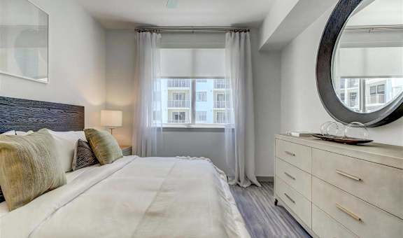 Spacious Bedroom with Wood Style Flooring