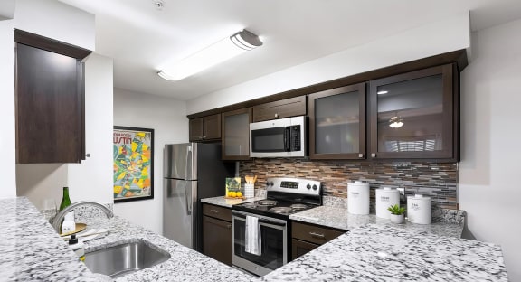 Mesa Verde Kitchen Upgraded Kitchen with Bar Top Granite Countertops Shaker Cabinets Stainless Appliances Undermount Sink