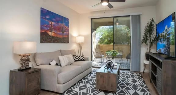 Living Room with Ceiling Fan and Patio Access