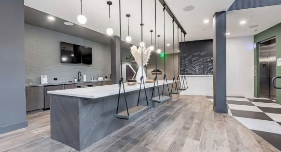 Counter area with interior swing seating, full wet bar, and chalkboard at Novel Cary