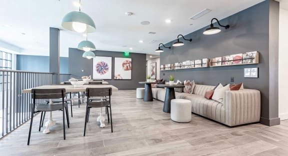 Cozy reading area with extra large sofa and magazine rack at Novel Cary