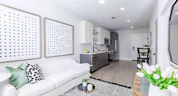 Cozy open floor plan with laminate wood floors and modern appliances at Novel Cary