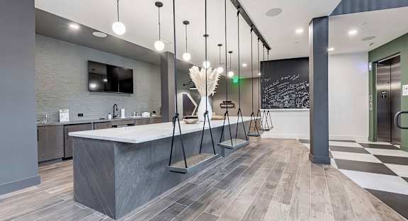 Counter area with interior swing seating, full wet bar, and chalkboard at Novel Cary