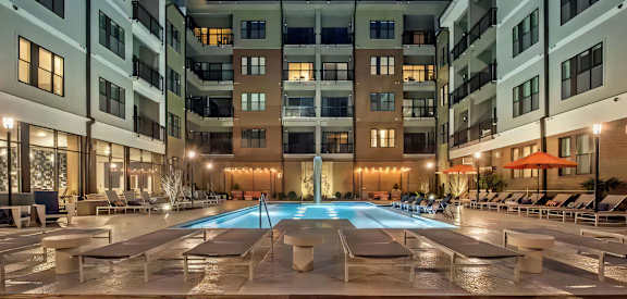 Resort Style Pool with Loungers in Evening
