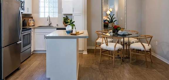 Amerige Pointe Apartment Kitchen Island Kitchen with Breakfast Bar at Amerige Pointe, Fullerton, CA