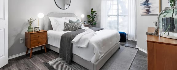 Mesa Verde Bedrooms Bright and Spacious Bedroom with Wood Look Vinyl Flooring Ceiling Fan and Crown Molding