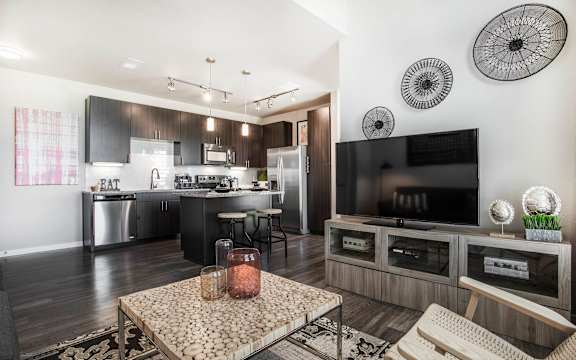 A modern kitchen with a black and white color scheme.