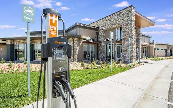 a gas pump in front of a building