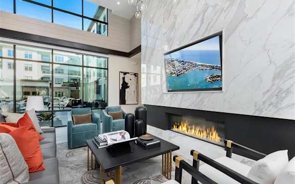 Modern Clubhouse Gathering Space with Marble Fireplace at The Elm at River Park