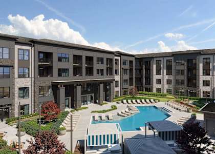A large building with a pool in front.