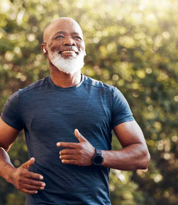 A man jogging in a park at Bridgewater Apartments in Duluth, GA, 30096