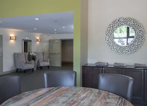 a dining room with a table and chairs