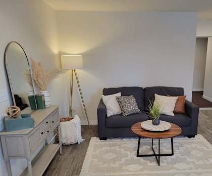 a living room with a couch and a table