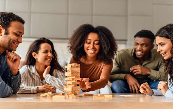 Group of people are playing Jenga game at Bridgewater Apartments in Duluth, GA, 30096