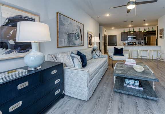 a living room filled with furniture and a table with a lamp at Retreat at Arden Farms, North Carolina