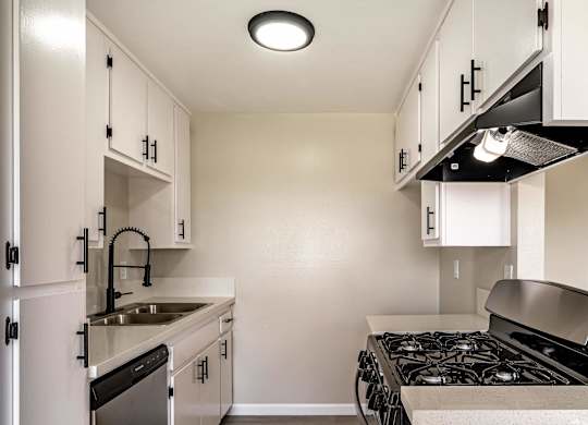 the preserve at ballantyne commons apartment kitchen with stove and sink at Colima Terrace Apts, Rowland Heights, CA 91748