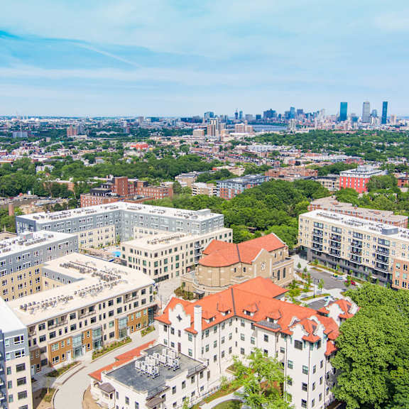 A cityscape with buildings and a clear sky.