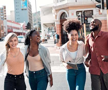 a group of people walking down a city street at Mirabelle Luxury Apartments, Kansas City, 64111