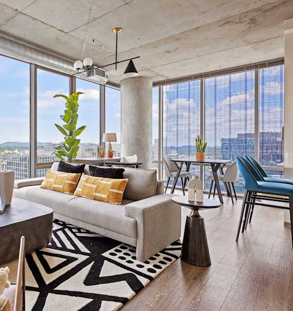 A modern living room with a view of the city.