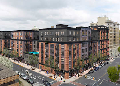 an aerial view of a large building on a city street