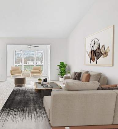 A modern living room with a fireplace and a large couch.