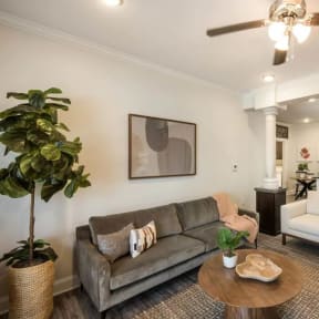 a living room with a couch and a table at Arlo Luxury homes Apartments, Little Rock, Arkansas