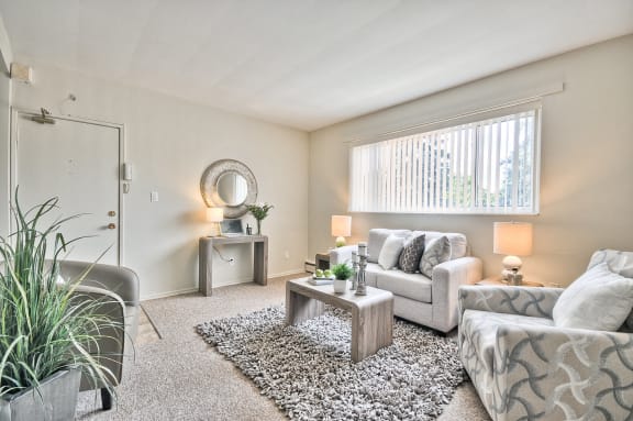 a living room with couches and a coffee table