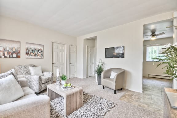 a living room with a couch and a chair