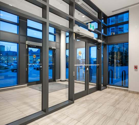 A set of double doors with a glass window on the left side.