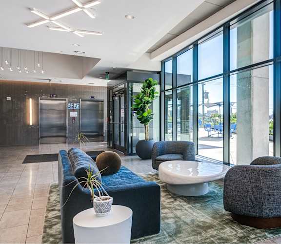 A modern lobby with a view of the city skyline.
