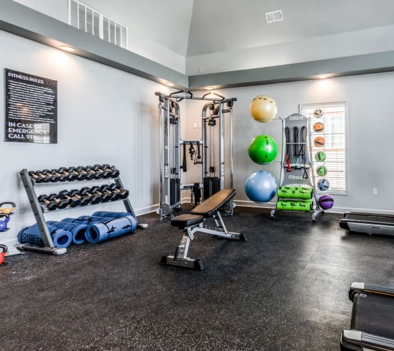 the preserve at ballantyne commons fitness room with weights and other exercise equipment at The links at Plum Creek Apartments, Castlerock Colorado